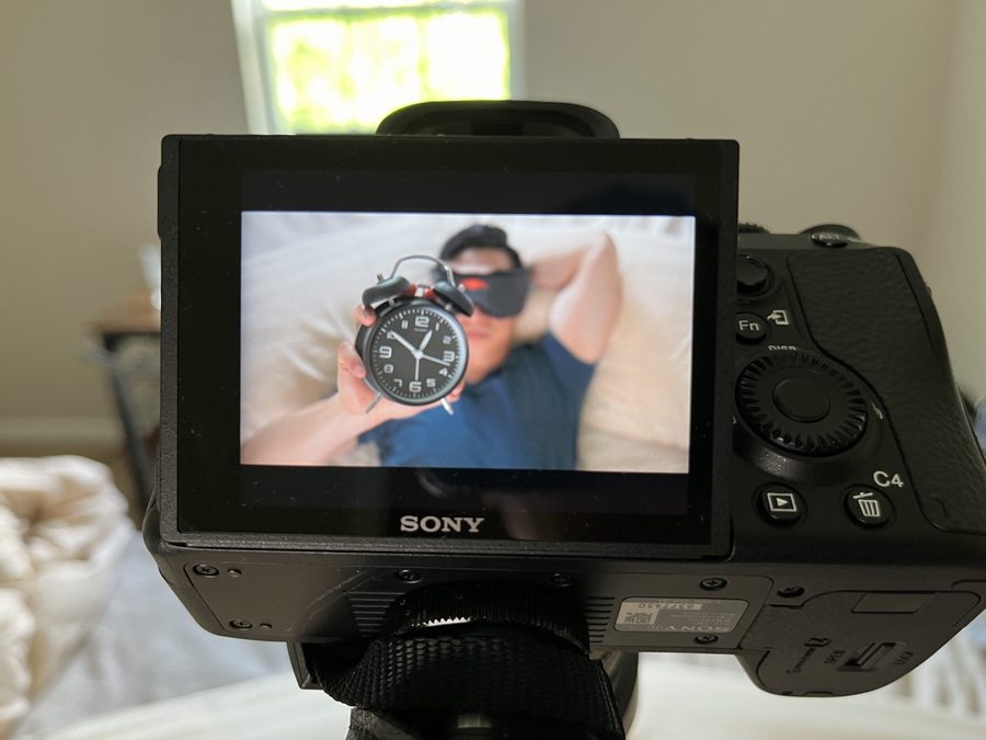 Behind the camera filming a scene for a video